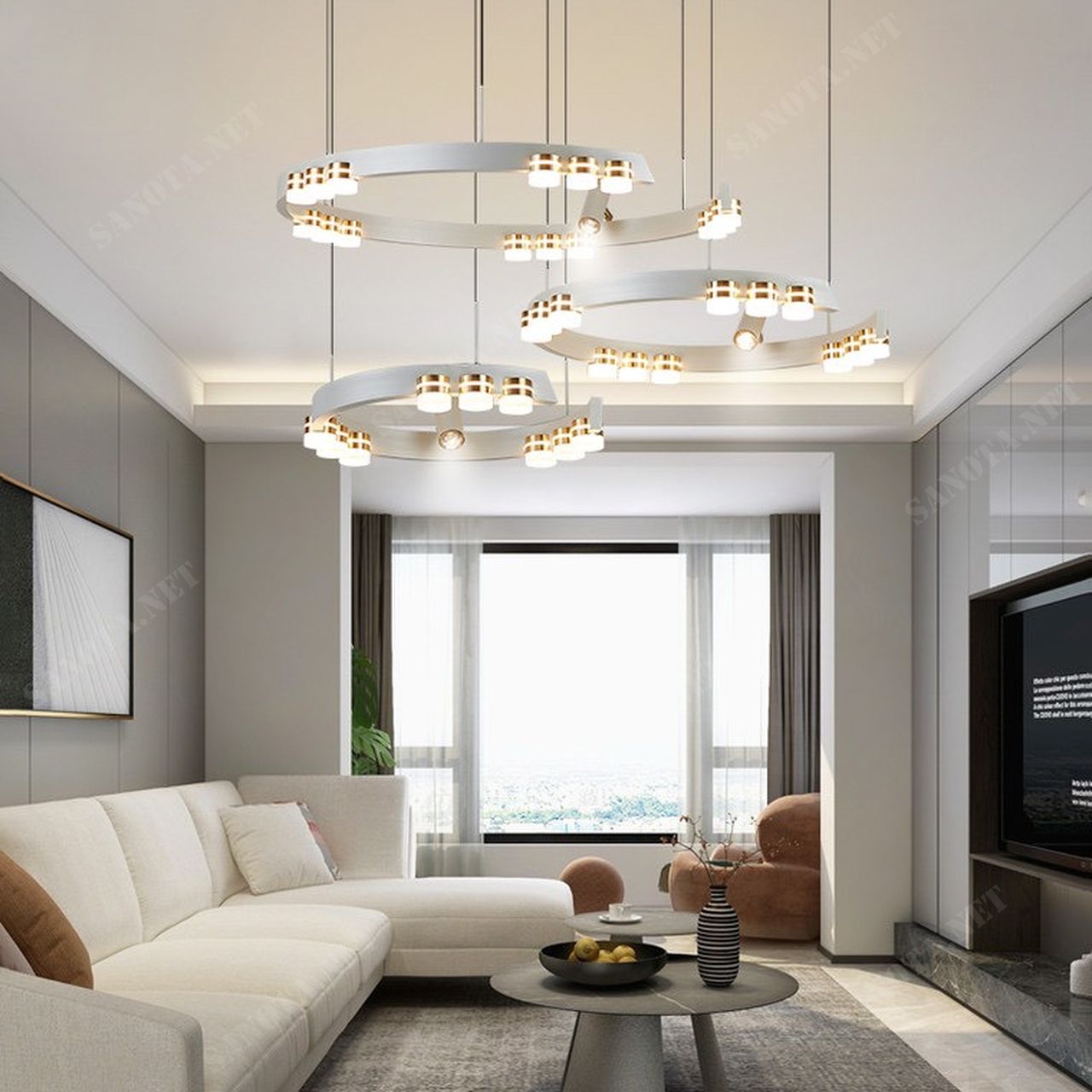 chiếc đèn ốp trần với thiết kế là một vòng tròn bị khuyết màu trắng cùng với đó là những bóng đèn led kết hợp với đèn rọi tạo nên một bức tranh ánh sáng nổi bật cả một không gian