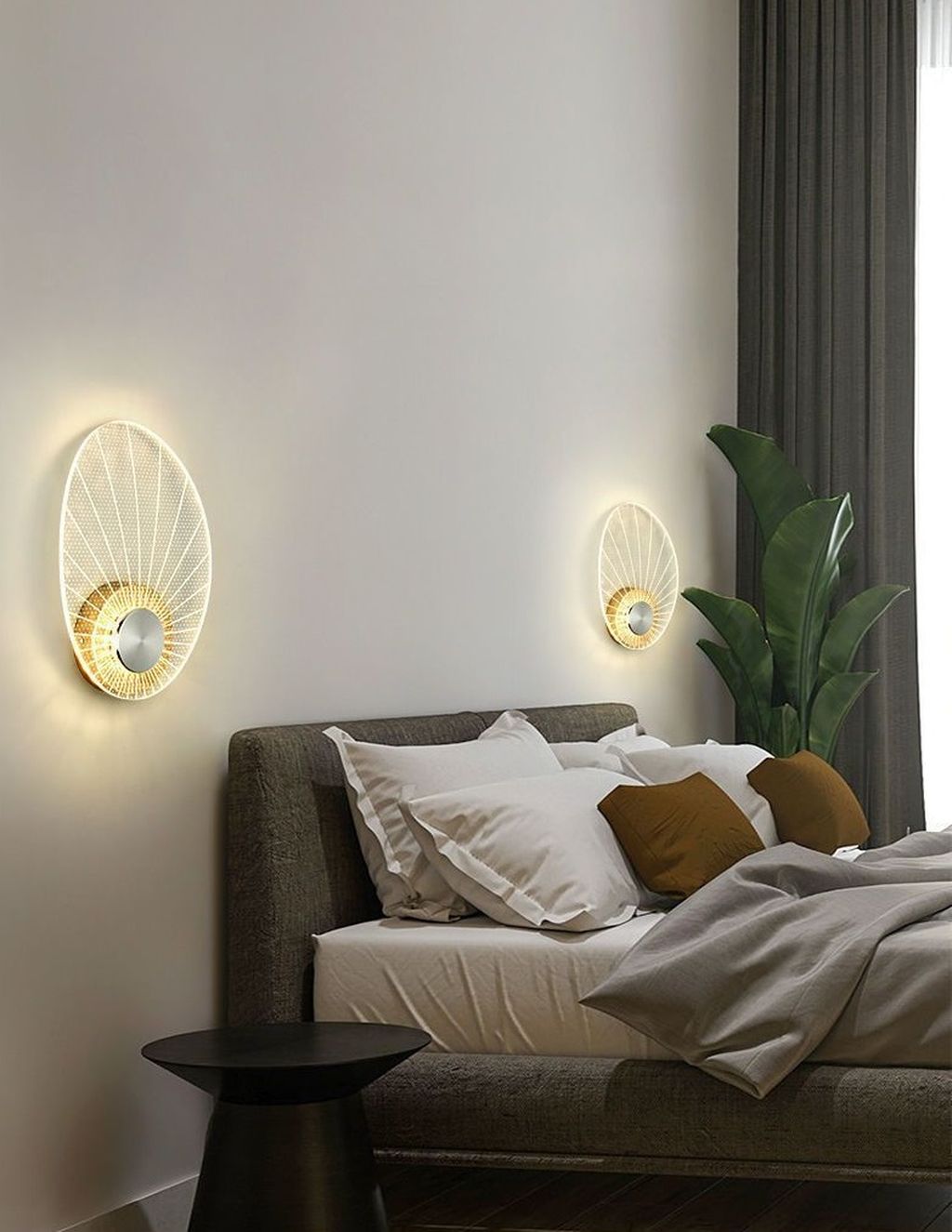 Với thiết kế hình oval độc đáo, được tạo nên từ những đường nét thanh mảnh và tinh xảo. Chiếc đèn như một tác phẩm nghệ thuật hiện đại, mang lại vẻ đẹp thanh thoát và cuốn hút. Điểm nhấn của chiếc đèn chính là ánh sáng dịu nhẹ. Ánh sáng lan tỏa qua lớp kính mờ với những đường tỏa sáng như tia nắng mặt trời. Ánh sáng không chỉ mang lại cảm giác ấm áp và dễ chịu mà còn tạo ra hiệu ứng thị giác đặc biệt. Biến không gian trở thành một bức tranh sống động và đầy mê hoặc.