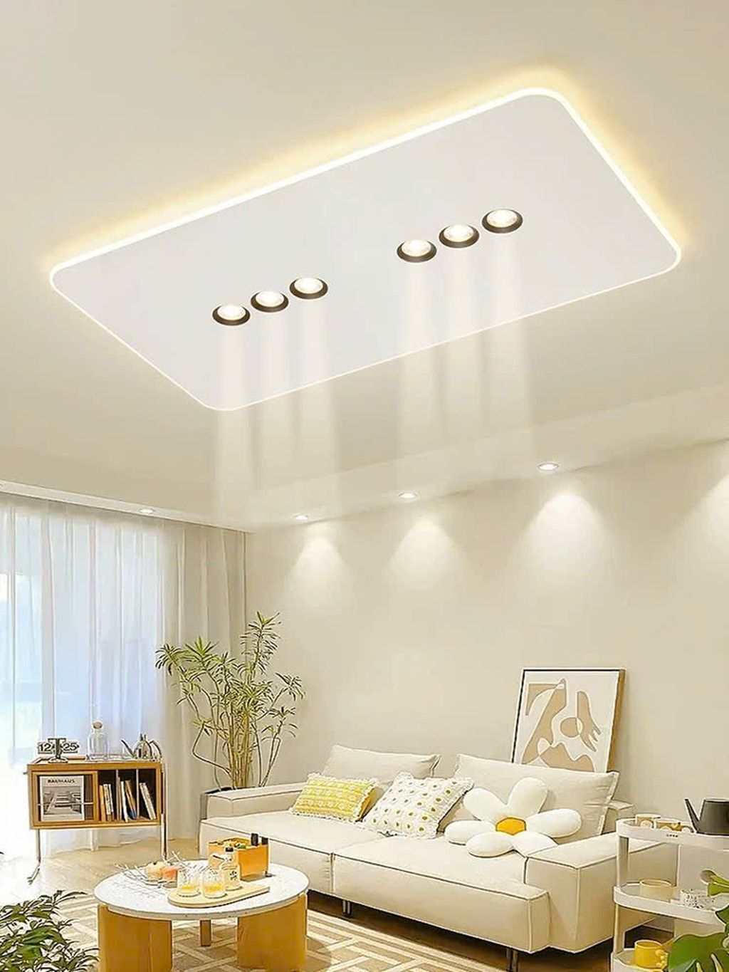 Đèn mâm ốp trần được thiết kế dạng hình chữ nhật bo tròn mềm mại. Với ánh sáng viền LED tỏa nhẹ nhàng xung quanh viền. Tạo nên một hiệu ứng ánh sáng lan tỏa tinh tế. Trung tâm đèn là cụm 6 mắt LED âm trần hiện đại, được bố trí cân xứng. Vừa đảm bảo khả năng chiếu sáng tập trung vừa mang lại điểm nhấn thẩm mỹ độc đáo.