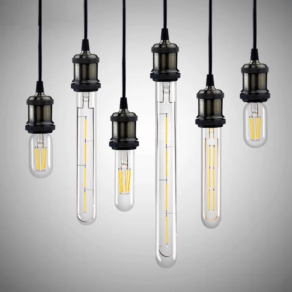 Thiết kế của bóng đèn lấy cảm hứng từ hình dáng ống nghiệm. Mang đến vẻ đẹp thanh lịch, hiện đại mà không kém phần cổ điển. Phần thân bóng được làm từ thuỷ tinh trong suốt cao cấp. Giúp ánh sáng tỏa đều tạo nên điểm nhấn thẩm mỹ đầy cuốn hút. Sự kết hợp hài hòa giữa các đường nét tối giản và sự sắc sảo trong từng chi tiết khiến chiếc đèn này trở thành một “tác phẩm nghệ thuật chiếu sáng” đúng nghĩa.